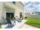 Backyard featuring patio seating and grill at 10826 Trailing Vine Dr, Tampa, FL 33610