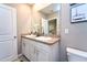 Bathroom with double sink vanity and framed mirror at 10826 Trailing Vine Dr, Tampa, FL 33610