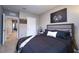 Nicely decorated bedroom featuring stylish bedding, a cool picture and a clean interior at 10826 Trailing Vine Dr, Tampa, FL 33610