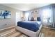 Bright and spacious bedroom with a king bed, soft natural light, and modern furnishings at 10826 Trailing Vine Dr, Tampa, FL 33610