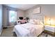 Charming bedroom with a cozy bed, a bright workspace, and a pleasant, inviting atmosphere at 10826 Trailing Vine Dr, Tampa, FL 33610