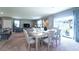 Open floor plan featuring a combined dining and living area with access to outdoor space at 10826 Trailing Vine Dr, Tampa, FL 33610
