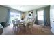 Inviting dining room with stylish furnishings, ample seating, and backyard views at 10826 Trailing Vine Dr, Tampa, FL 33610