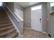 Entryway with stairs and white front door at 10826 Trailing Vine Dr, Tampa, FL 33610
