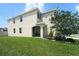Attractive home with a well-maintained lawn and charming covered entry at 10826 Trailing Vine Dr, Tampa, FL 33610