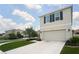 Attractive two-story home boasting a two-car garage, manicured lawn, and inviting curb appeal at 10826 Trailing Vine Dr, Tampa, FL 33610