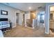 Upstairs hallway with multiple rooms, including bedrooms and bathrooms, and neutral carpeting at 10826 Trailing Vine Dr, Tampa, FL 33610