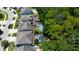Aerial view of a community with backyard pools and mature landscaping at 11606 Quiet Forest Dr, Tampa, FL 33635