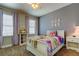 Charming bedroom featuring a cozy bed, soft lighting, and comforting decor for relaxation at 11606 Quiet Forest Dr, Tampa, FL 33635