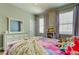 Comfortable bedroom with a cozy bed, dresser, and bookshelves filled with stuffed animals at 11606 Quiet Forest Dr, Tampa, FL 33635