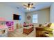 Comfortable bonus room featuring plush carpeting, ceiling fan, and a fun play area at 11606 Quiet Forest Dr, Tampa, FL 33635