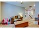 Cozy bonus room showcasing neutral walls, plush seating, ottoman, and playroom area at 11606 Quiet Forest Dr, Tampa, FL 33635