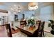 Inviting dining space with a wooden table, comfortable seating, and a seamless transition to the kitchen at 11606 Quiet Forest Dr, Tampa, FL 33635