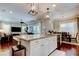 Gourmet kitchen island overlooks the living and dining areas, perfect for entertaining guests at 11606 Quiet Forest Dr, Tampa, FL 33635