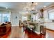 Bright, modern kitchen with white cabinets, island seating, and stainless steel appliances at 11606 Quiet Forest Dr, Tampa, FL 33635