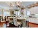 Well-appointed kitchen with quartz countertops, stainless appliances, and island seating at 11606 Quiet Forest Dr, Tampa, FL 33635