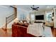 Inviting living room with a plush rug, leather sofas, and staircase at 11606 Quiet Forest Dr, Tampa, FL 33635