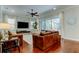 The living room features hardwood floors, a ceiling fan, and sliding glass doors at 11606 Quiet Forest Dr, Tampa, FL 33635