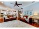 Spacious living room with hardwood floors, comfortable sofas, and an open layout to the kitchen at 11606 Quiet Forest Dr, Tampa, FL 33635