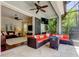 Outdoor patio featuring orange wicker seating and a clear view into the living room at 11606 Quiet Forest Dr, Tampa, FL 33635