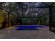 Tranquil, enclosed pool with landscape views, perfect for evening swims and relaxation at 11606 Quiet Forest Dr, Tampa, FL 33635