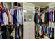 Well-organized walk-in closet featuring ample shelving and hanging space for clothing and accessories at 11606 Quiet Forest Dr, Tampa, FL 33635