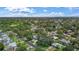 A high up aerial showcases the home's position within the community and neighborhood streets at 11764 Pinedale Ave, Seminole, FL 33772