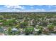 A panoramic aerial highlights the home and the neighborhood's peaceful, tree-lined streets at 11764 Pinedale Ave, Seminole, FL 33772