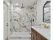 Bathroom featuring a shower with marble tile and new vanity at 11764 Pinedale Ave, Seminole, FL 33772