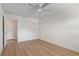 Bedroom features include ceiling fan, wood-look floors and new paint at 11764 Pinedale Ave, Seminole, FL 33772