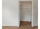 A closet with shelving and new light wood look flooring at 11764 Pinedale Ave, Seminole, FL 33772