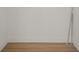 Empty closet interior showing baseboard trim and light wood-look flooring at 11764 Pinedale Ave, Seminole, FL 33772