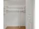 Closet with built-in shelving and light wood-look flooring at 11764 Pinedale Ave, Seminole, FL 33772