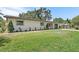 Well-manicured front lawn and charming exterior of this home with a welcoming curb appeal at 11764 Pinedale Ave, Seminole, FL 33772