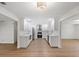 Bright, modern kitchen featuring stainless appliances, white cabinets, countertops, and sleek hardware at 11764 Pinedale Ave, Seminole, FL 33772
