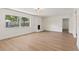 Bright living room featuring a fireplace and hardwood floors at 11764 Pinedale Ave, Seminole, FL 33772
