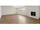 Bright living room featuring a fireplace and hardwood floors at 11764 Pinedale Ave, Seminole, FL 33772