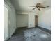 Bedroom with new tile flooring, ceiling fan and sliding door to the outside at 1185 36Th Ne Ave, St Petersburg, FL 33704