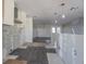 Renovated kitchen featuring tile flooring and modern features in progress at 1185 36Th Ne Ave, St Petersburg, FL 33704