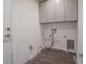 Unfinished laundry room with gray cabinets, tile floor, and electrical wiring for appliances at 1185 36Th Ne Ave, St Petersburg, FL 33704