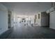 Spacious living room featuring tile flooring and ample natural light during renovation at 1185 36Th Ne Ave, St Petersburg, FL 33704