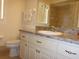 Bathroom featuring a vanity with marble countertop, white cabinetry, and tile shower at 12271 Centralia Rd, Weeki Wachee, FL 34614