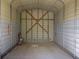 Spacious carport featuring a metal frame with horizontal siding and an open design at 12271 Centralia Rd, Weeki Wachee, FL 34614