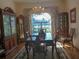 Formal dining room with chandelier, a large window, and hardwood floors at 12271 Centralia Rd, Weeki Wachee, FL 34614