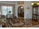 Elegant living room with hardwood floors and archway into dining area at 12271 Centralia Rd, Weeki Wachee, FL 34614