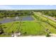 Aerial view of the community features a pond with fountain and large green space at 12517 Nantahala Run, Parrish, FL 34219