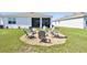 Landscaped backyard sitting area with gravel and seating, perfect for outdoor relaxation at 12517 Nantahala Run, Parrish, FL 34219