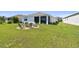 Large backyard with a seating area around a fire pit, ideal for outdoor gatherings and relaxation at 12517 Nantahala Run, Parrish, FL 34219