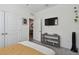 Airy bedroom with a TV, shelving unit, and a calming neutral color palette at 12517 Nantahala Run, Parrish, FL 34219
