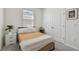 Bright bedroom featuring a comfortable bed, neutral tones, and closet for storage at 12517 Nantahala Run, Parrish, FL 34219